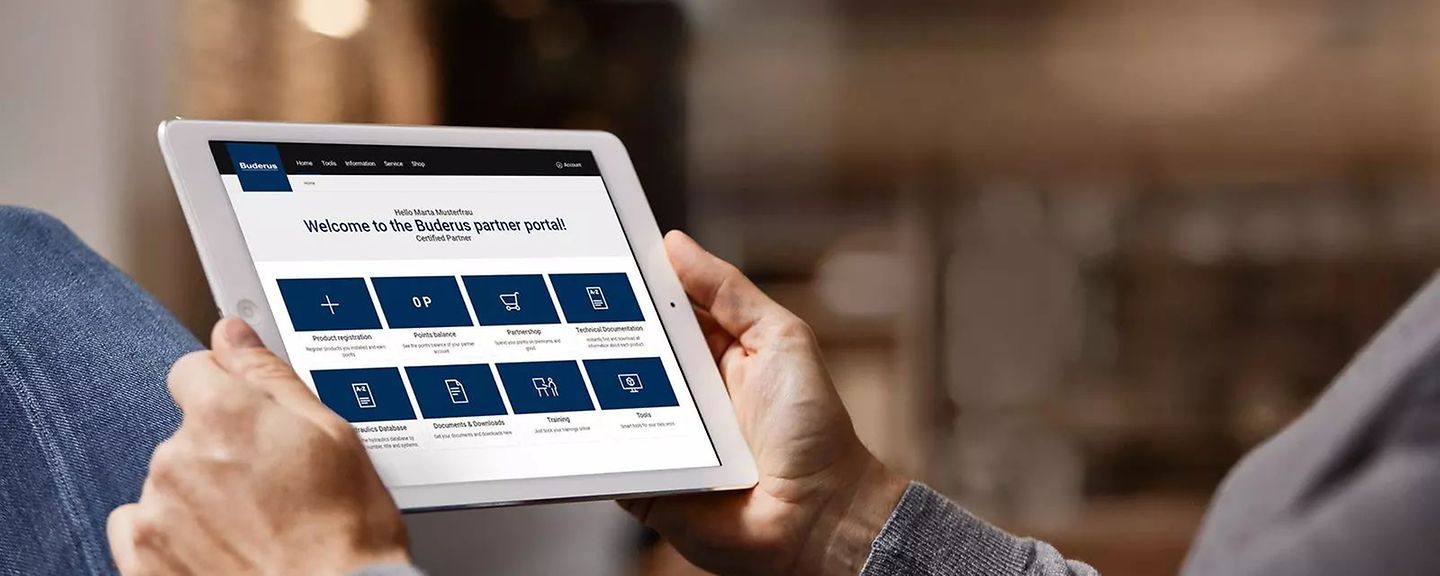person_uses_partner_portal_on_tablet_1600x900 person_uses_partner_portal_on_tablet_1600x900